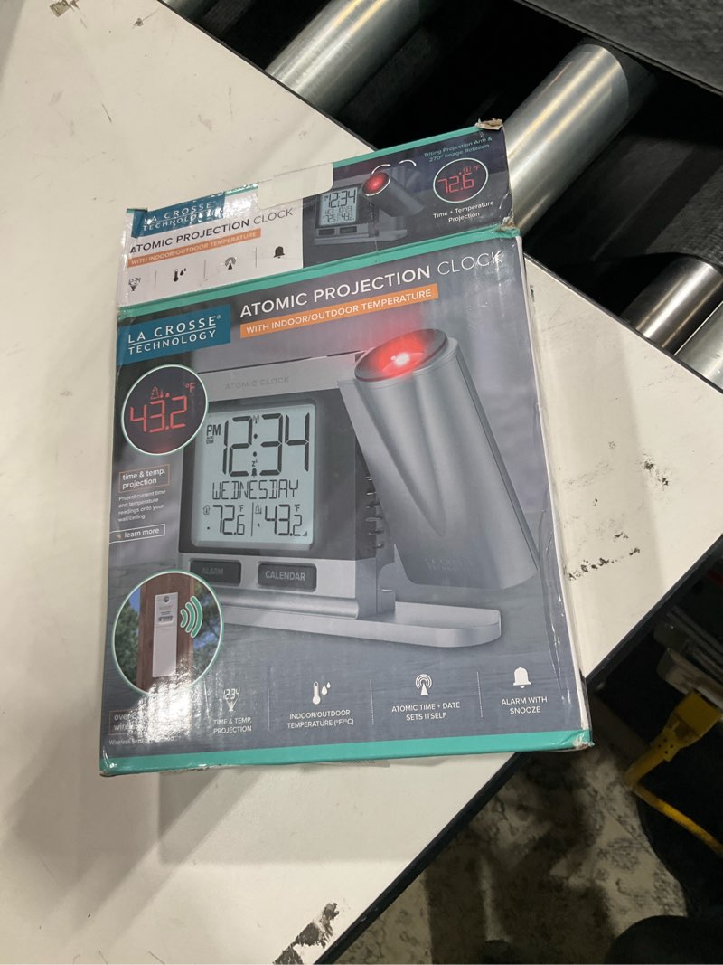 Condition photo showing As Is for La Crosse Technology 616-12667-INT Silver Atomic Projection Alarm Clock with Temperature Silver Clock