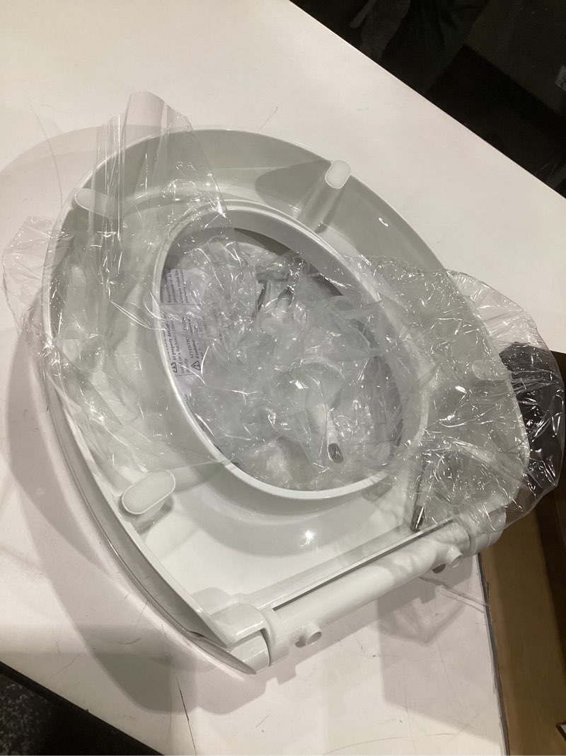 Condition photo showing As Is for kohler 25876-0 hyten 3" height, elevated soft close round toilet seat, contoured seat with grip-tight bumpers, quick-attach hardware, white white round