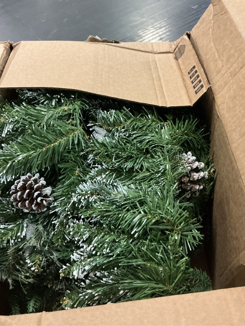 Condition photo showing As Is for christmas garland pre-lit 9 ft with 50 led lights, battery operated fireplace stairs mantle door indoor outdoor, decorated pine cone and snow style green white battery operated