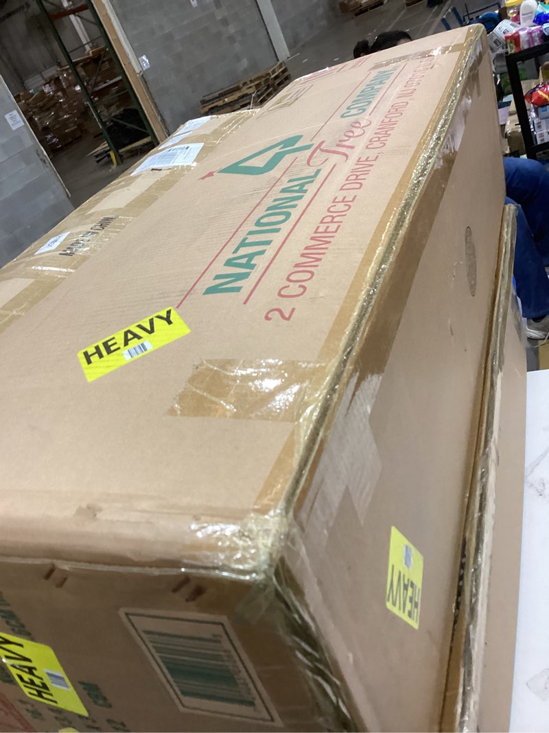 Condition photo showing As Is for National Tree Company Pre-Lit Artificial Christmas Tree  Green  Dunhill Fir  Clear Lights  Includes Stand  6.5 Feet