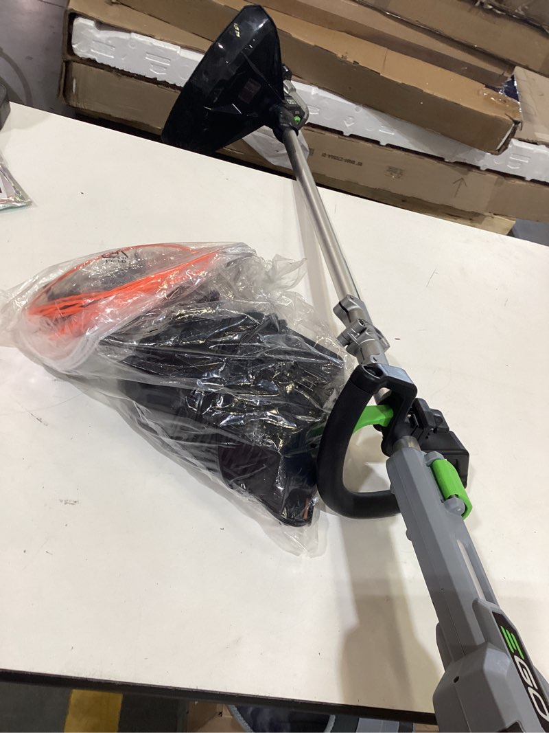 Condition photo showing As Is for ego powerload 56-volt 15-in telescopic shaft battery string trimmer 2.5 ah (battery and charger included)