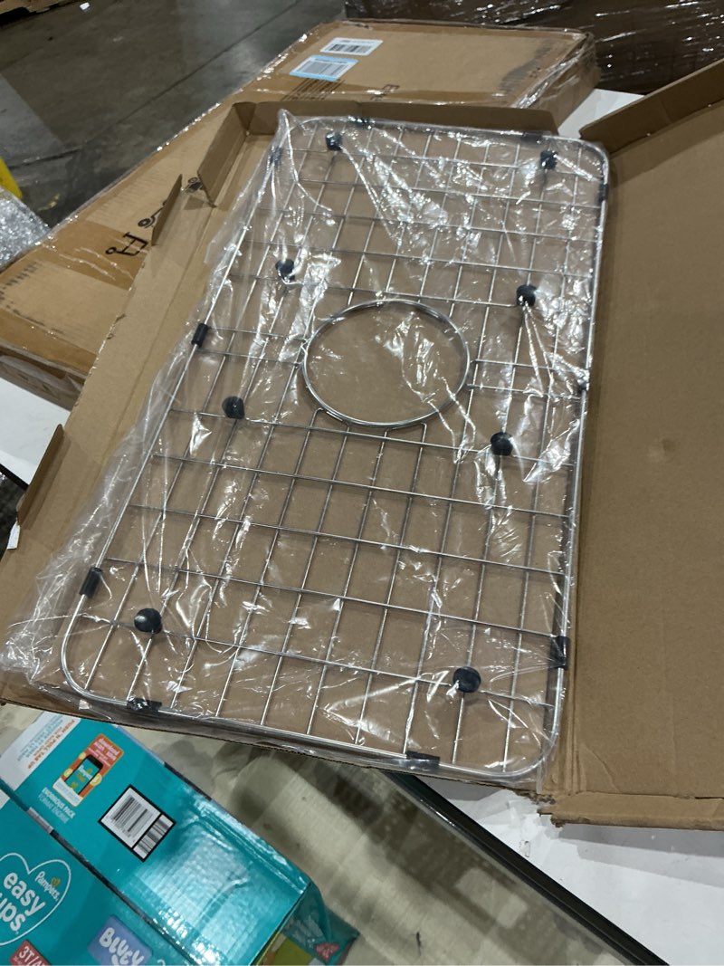 Condition photo showing Good Condition for serene valley sink bottom grid 24-1/8" x 12-5/8", centered drain with corner radius 1-1/2", sink protector nlw2412c