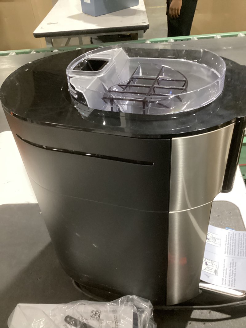 Condition photo showing As Is for de'longhi true brew drip coffee maker, built in grinder, single serve, 8 oz to 24 oz, hot or iced coffee, stainless, cam51025mb