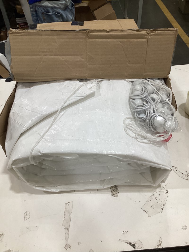 Condition photo showing Good Condition for This item appears to be a large white tarp or a similar heavy-duty covering packaged with ball bungees for securing it.  
