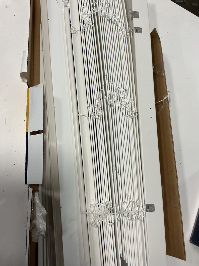 Condition photo showing As Is for levolor trim+go 2-in slat width 27-in x 64-in cordless white faux wood room darkening full-view standard horizontal blinds