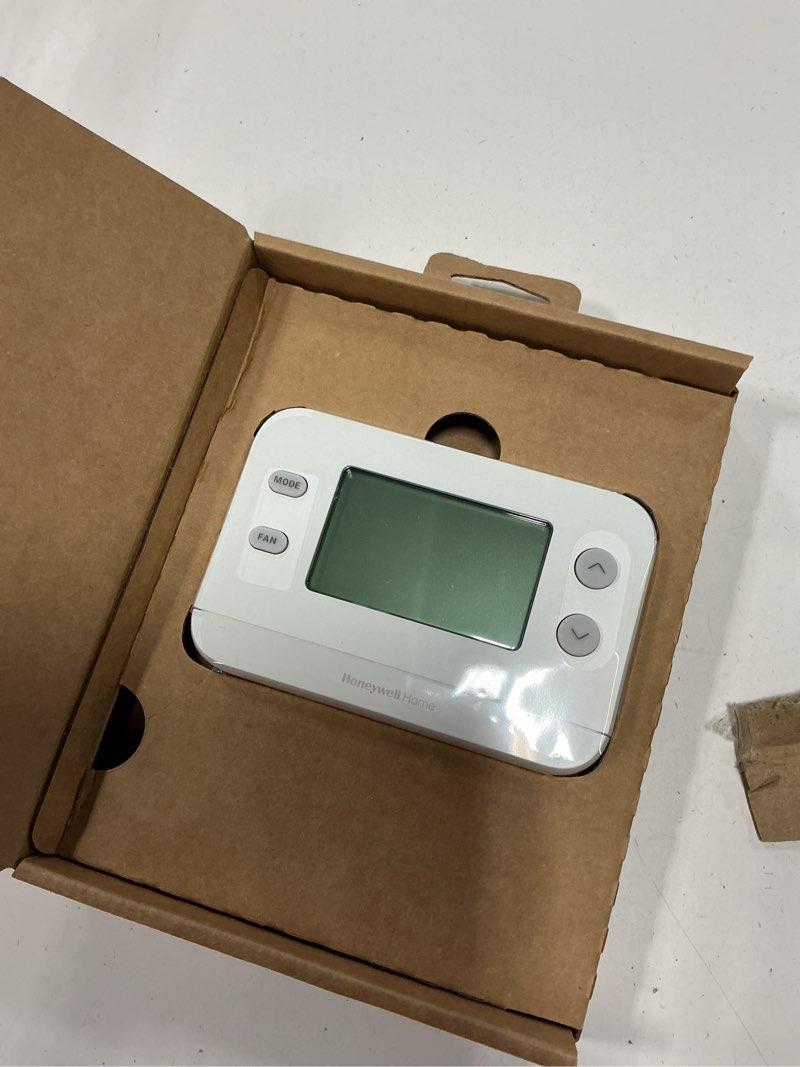Condition photo showing As Is for honeywell home x1n heating and cooling push button non-programmable thermostat