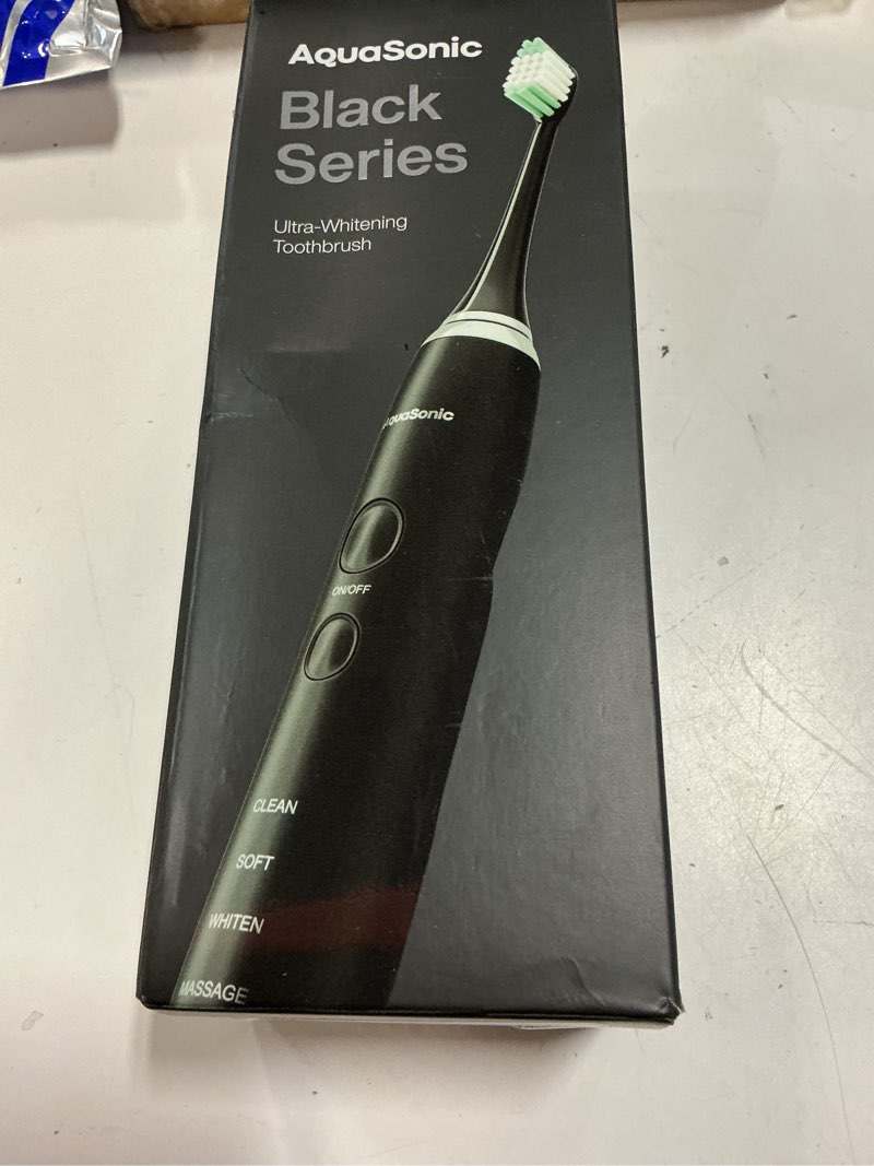 Condition photo showing New/Like New for aquasonic black series ultra whitening toothbrush – ada accepted electric toothbrush- 8 brush heads & travel case – 40,000 vpm electric motor & wireless charging - 4 modes w smart timer 1 count (pack of 1)