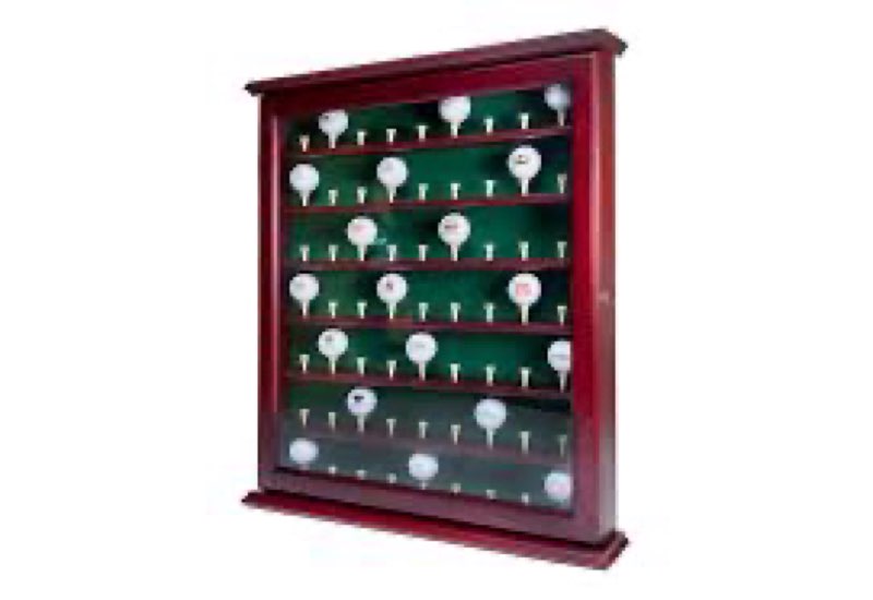 the clubhouse collection executive golf ball display cabinet is a mahogany-stained wood case designed to hold 63 balls with a green felt background