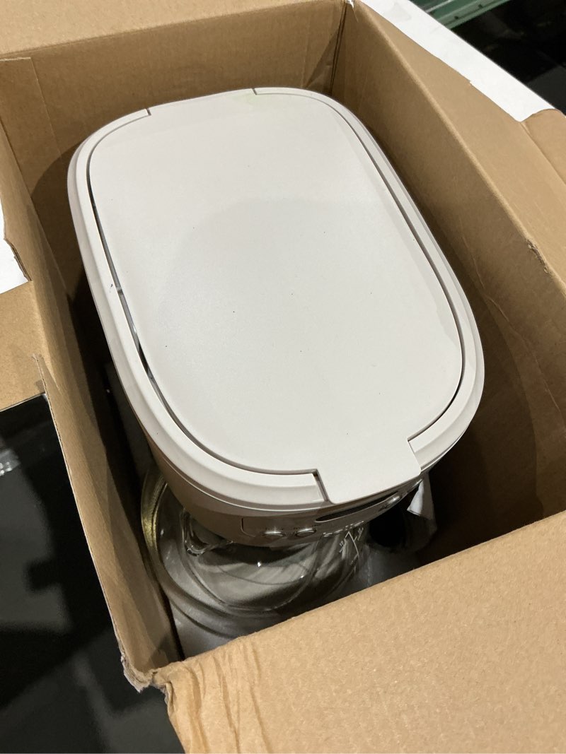 Condition photo showing As Is for bella 12 cup programmable coffee marker, reusable dishwasher safe accessories, easy lcd diaply, auto shutoff, 900 watt, oatmilk