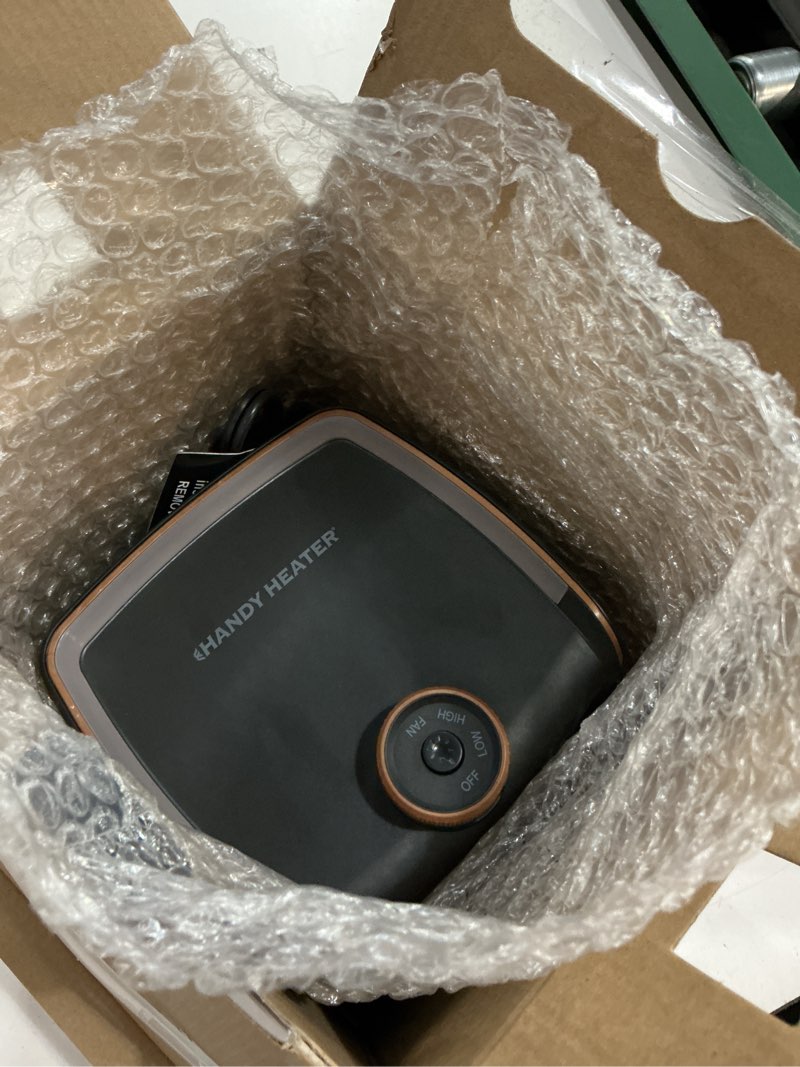 Condition photo showing As Is for handy heater instant heat space heater, lightweight and portable