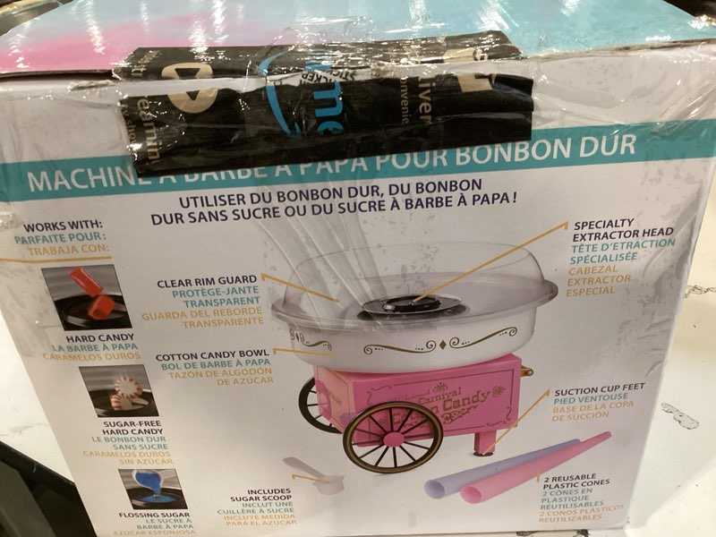 Condition photo showing As Is for nostalgia vintage hard and sugar free candy countertop cotton candy maker, includes 2 reusable cones and sugar scoop – pink