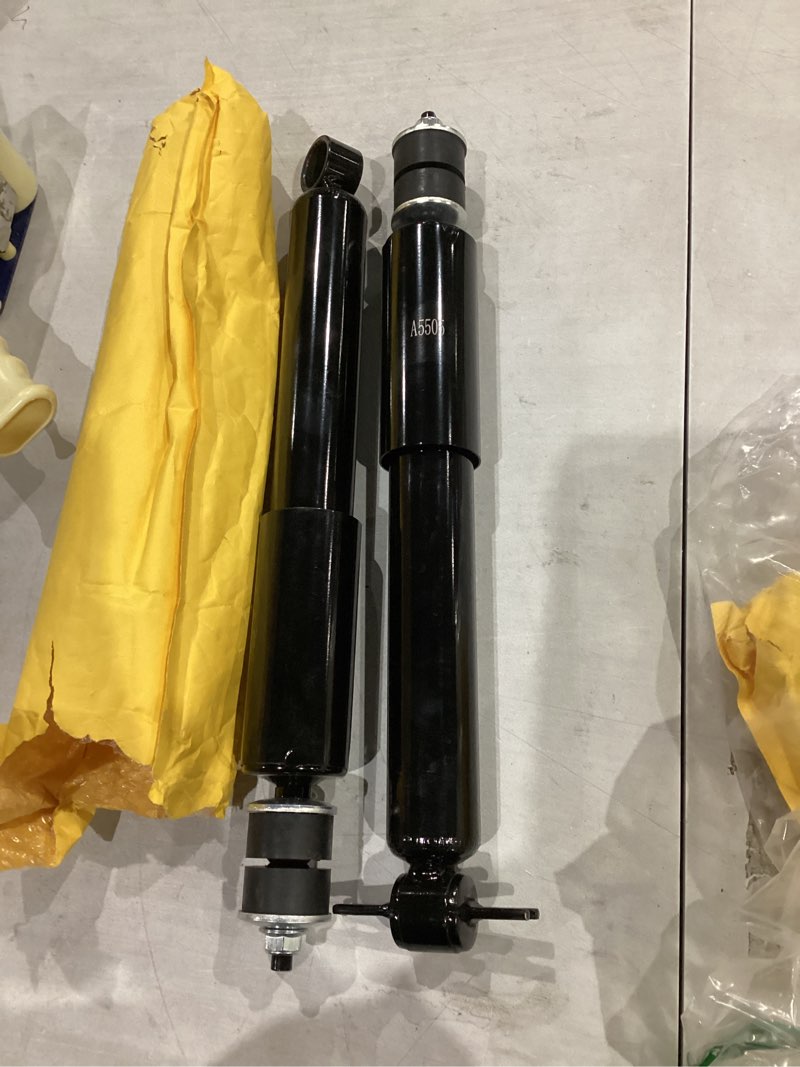 Condition photo showing As Is for similar not exact     shock absorbers, specifically model a5505, commonly used for vehicles like chevy tahoe, suburban, and gmc sierra.