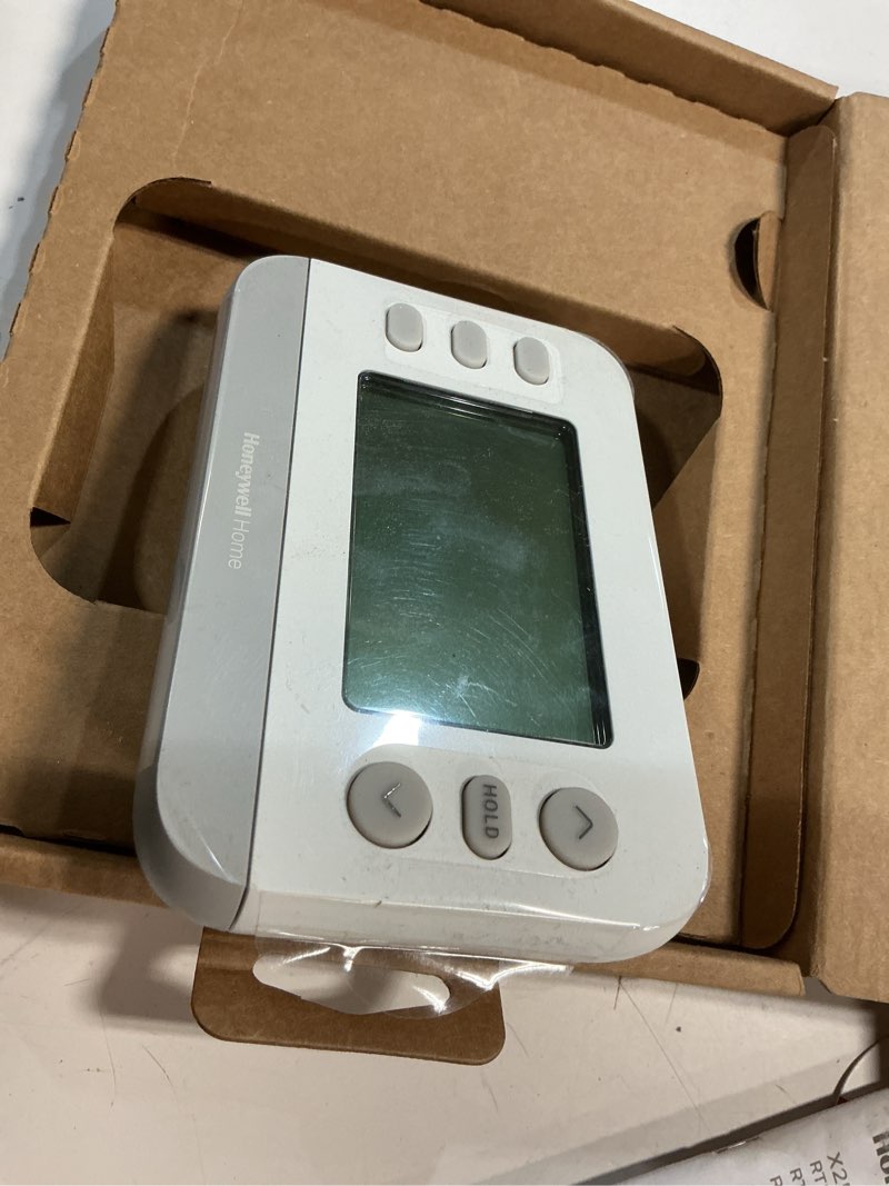 Condition photo showing As Is for honeywell home x2p heating and cooling push button programmable thermostat