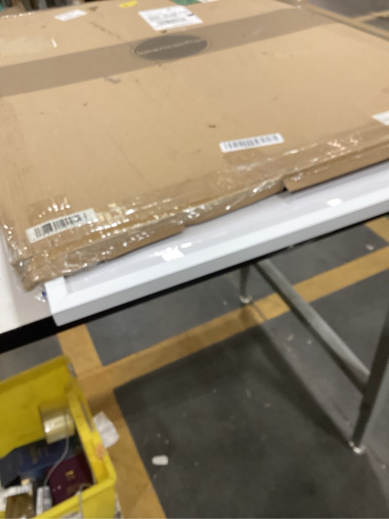 Condition photo showing As Is for Americanflat 24x34 Poster Frame with Polished Plexiglass - Use as 20x30 Frame with Mat or Display 24x34 Photo Without Mat - Streamline Collection - Thin Border Picture Frames for Wall - White White 24x34 1 Pack