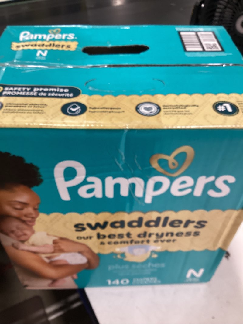 Condition photo showing As Is for pampers swaddlers newborn diapers, size newborn (10 lbs), 140 count, fragrance free, hypoallergenic, absorbent, pediatrician recommended, skin safe newborn 140