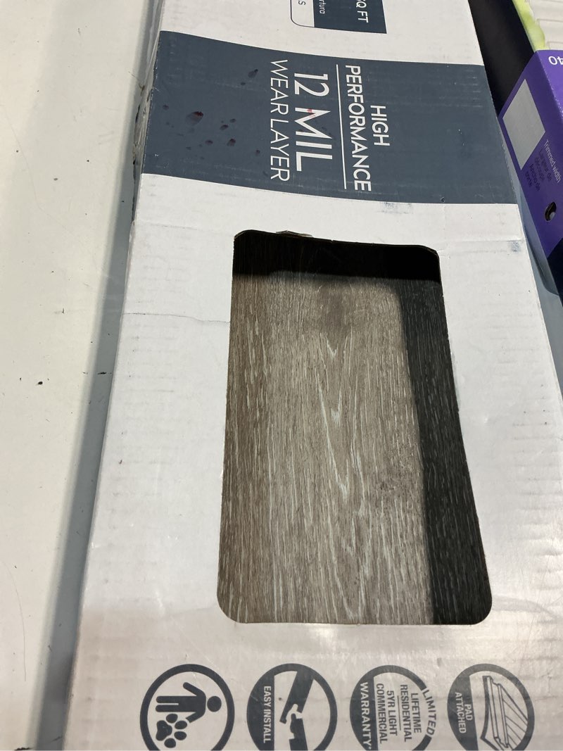 Condition photo showing As Is for Style Selections Dove Tail Oak 12-mil x 7-in W x 48-in L Waterproof Luxury Vinyl Plank Flooring ( 23.21-