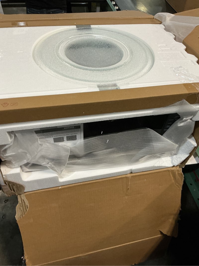 Condition photo showing New/Like New for ge countertop microwave oven,1, 200-watt capacity, 2.0 cubic ft., 8 auto setting cooking settings, child-lock technology, kitchen essentials for the countertop, dorm room or apartment, stainless steel 2.0 cu.ft. stainless steel
