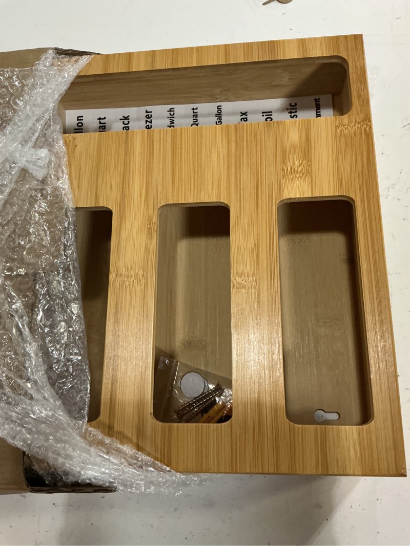 Condition photo showing New/Like New for storage bag organizer with foil and plastic wrap organizer , aluminum foil dispenser with cutter, bamboo 6 in 1 baggie organizer suitable for gallon, quart, sandwich, snack
