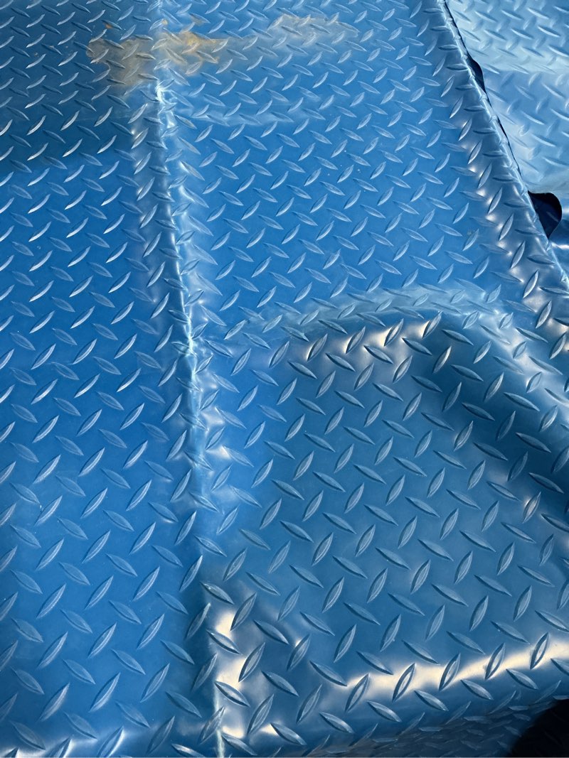 Condition photo showing As Is for blue floor mat 43x43