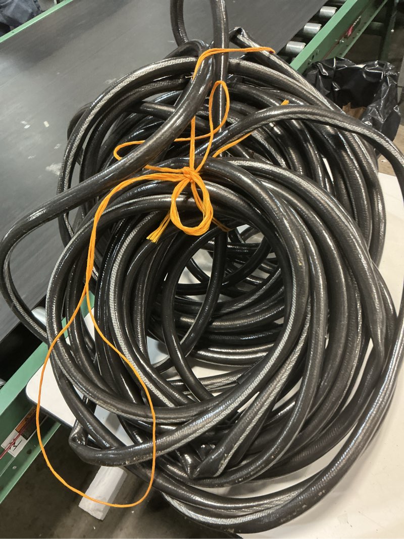 Condition photo showing As Is for heavy -duty kink free vinyl gray coiled hose