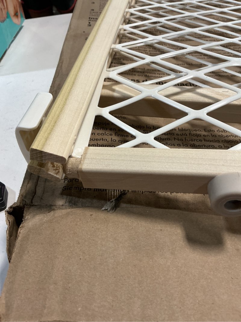 Condition photo showing As Is for Toddleroo by North States Diamond Mesh Wooden Baby Gate: 26.5"- 42" Wide. Pressure Mounted Baby Gate for Doorway. (23" Tall, Sustainable Hardwood)