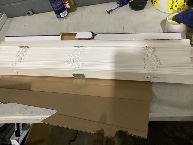 Condition photo showing As Is for levolor trim+go 2-in slat width 35-in x 64-in cordless white faux wood room darkening horizontal blinds