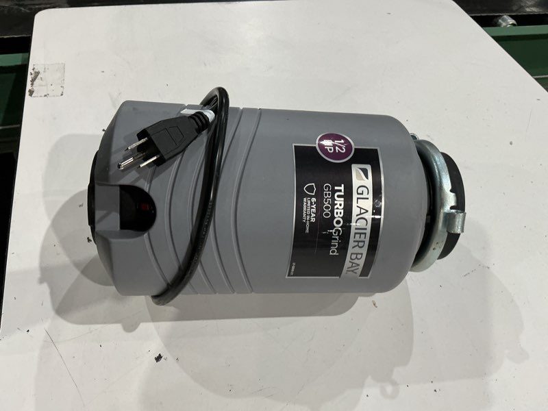 Condition photo showing As Is for turbogrind 1/2 hp. continuous feed garbage disposal with power cord