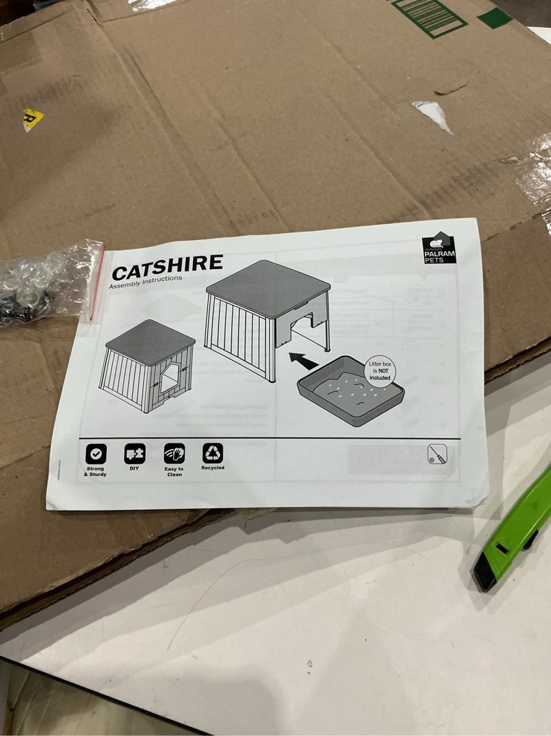 Condition photo showing As Is for catshire house/litterbox