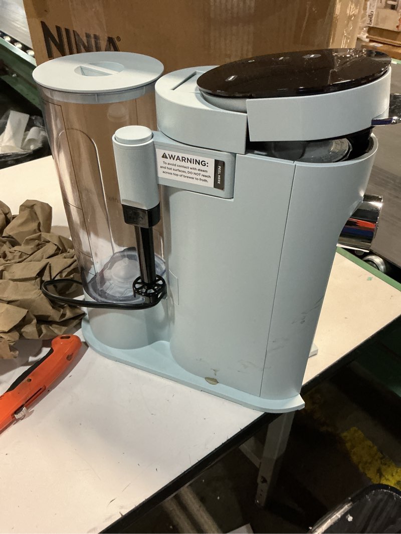 Condition photo showing item condition for Ninja Pods & Grounds Specialty Single-Serve Coffee Maker, K-Cup Pod Compatible, Built-In Milk Frother, 6-oz. Cup to 24-oz. Travel Mug Sizes, Iced Coffee Maker, Glacier Blue, PB051GB