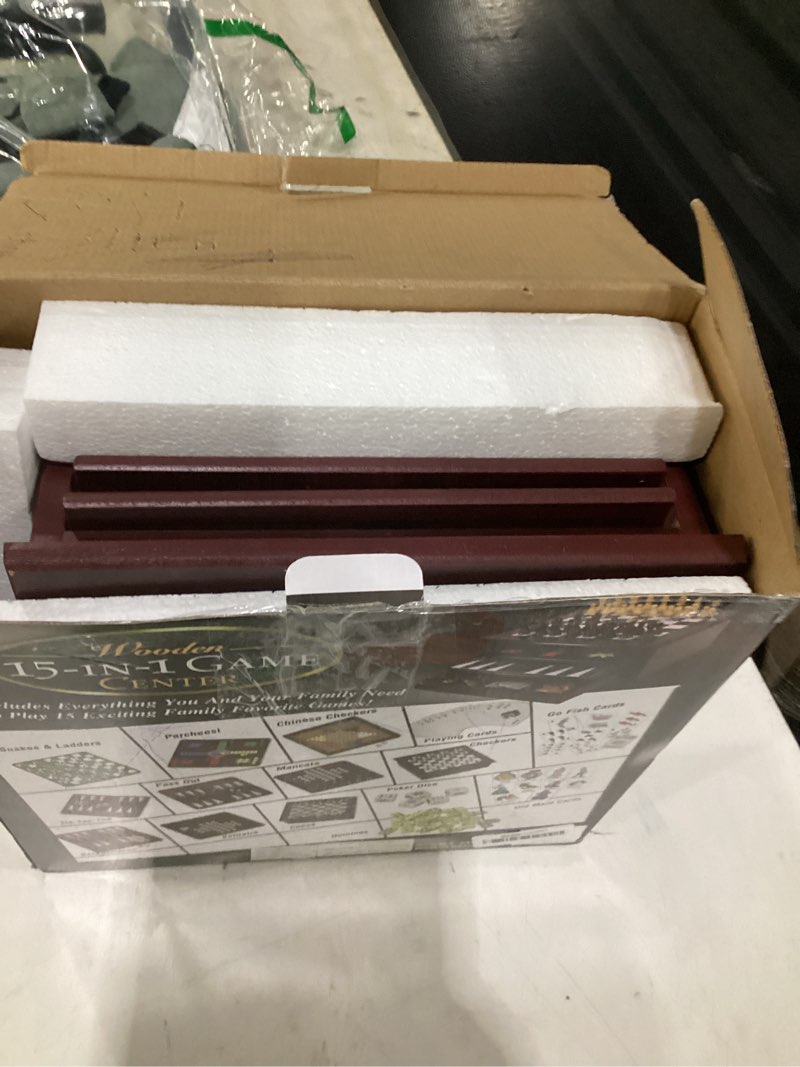 Condition photo showing As Is for board game set - deluxe 15 in 1 tabletop wood-accented game center with storage drawer (checkers, chess, chinese checkers, parcheesi, tictactoe, solitaire, snakes and ladders, mancala, backgammon, poker dice, playing cards, go fish, old maid, and dominos)