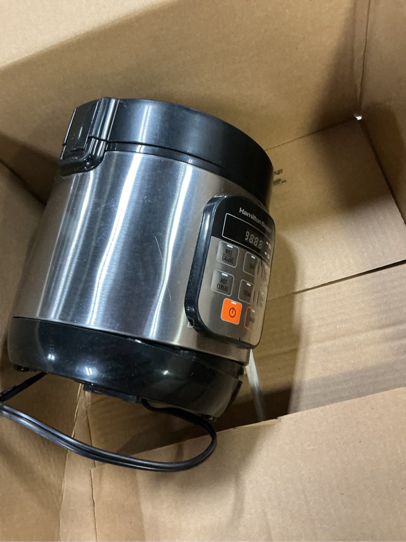 Condition photo showing As Is for Hamilton Beach Digital Programmable Rice Cooker & Food Steamer, with Slow Hard-Boiled Egg Functions, Egg/Steam Tray, Small & Compact, 6 Cups Cooked (3 Uncooked), Stainless Steel (37524) Stainless Steel 6 Cups Cooked (3 Uncooked)