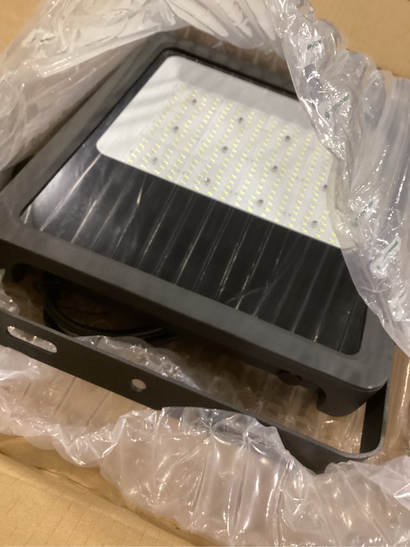 Condition photo showing As Is for AIKVSXER 36000Lm LED Stadium Flood Lights 1500W Equivalent Commercial Area Lighting 6000K IP65 Waterproof Arena Lights LED Work Light for Courts Gym Sport Fields 1 Pack Black 240W-1 Pack