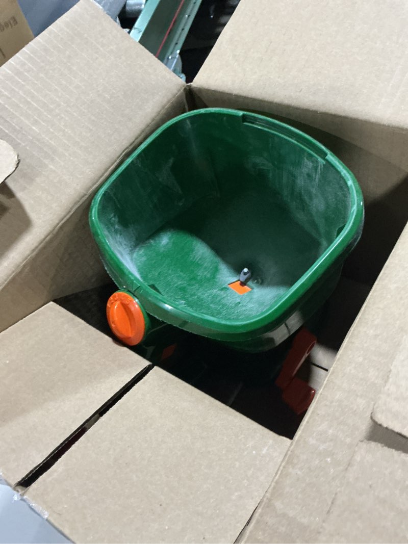 Condition photo showing As Is for Scotts Whirl Hand-Powered Spreader for Grass Seed, Fertilizer, Salt, Ice Melt, Handheld Spreader Holds up to 1,500 sq. ft. Product