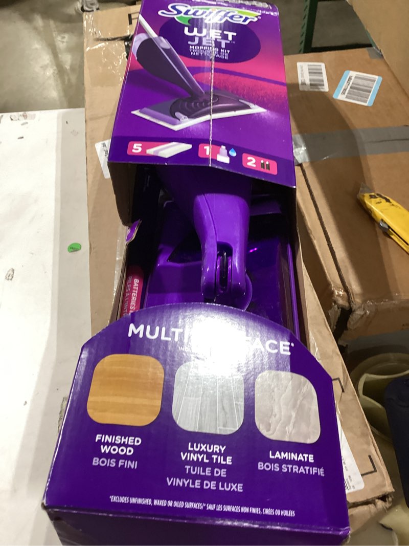 Condition photo showing As Is for swiffer wetjet hardwood and floor spray mop cleaner starter kit, includes: 1 power mop, 10 pads, cleaning solution, batteries 1 kit cleaner kit similiar product