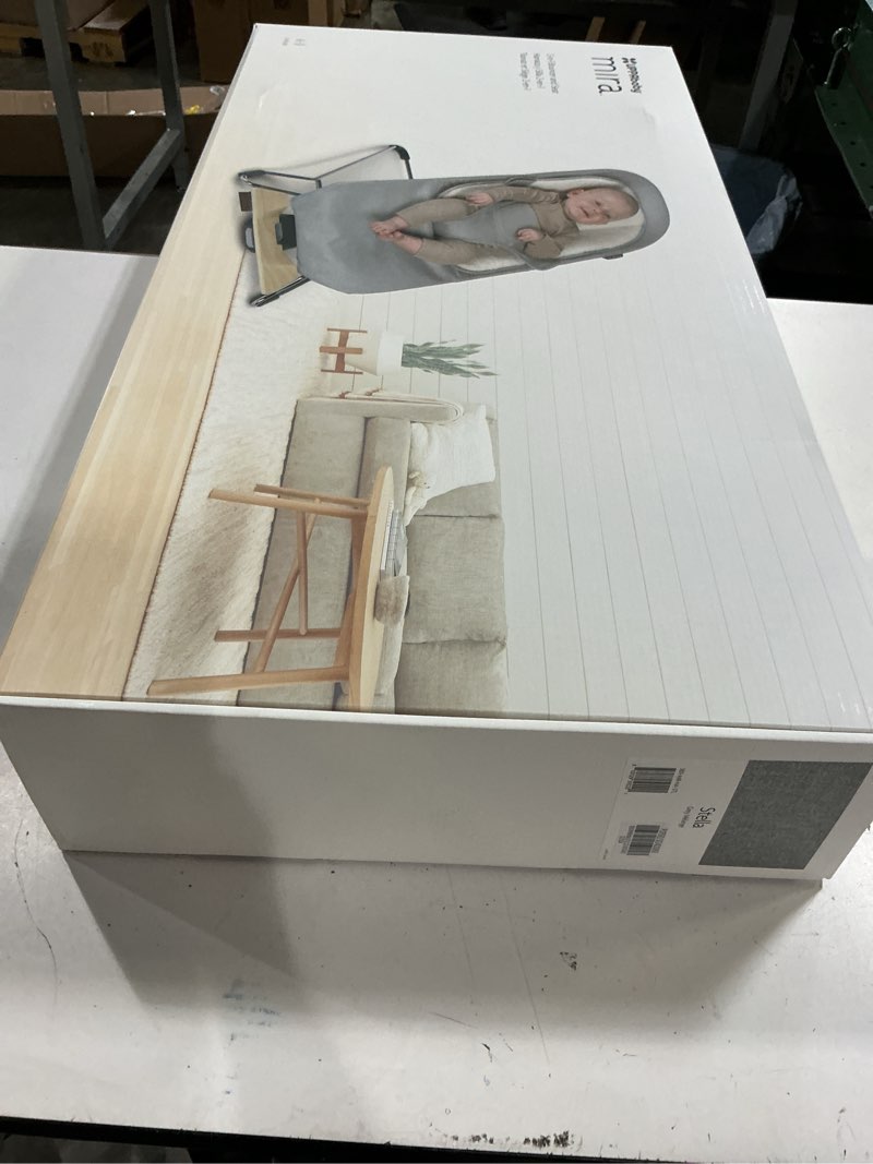 Condition photo showing New/Like New for uppababy mira bouncer/portable 2-in-1 bouncer + seat grows with your baby/greenguard® gold, jpma + fsc® certified/cozy seat liner + storage bag included/stella (grey mélange/silver chrome/maple wood)