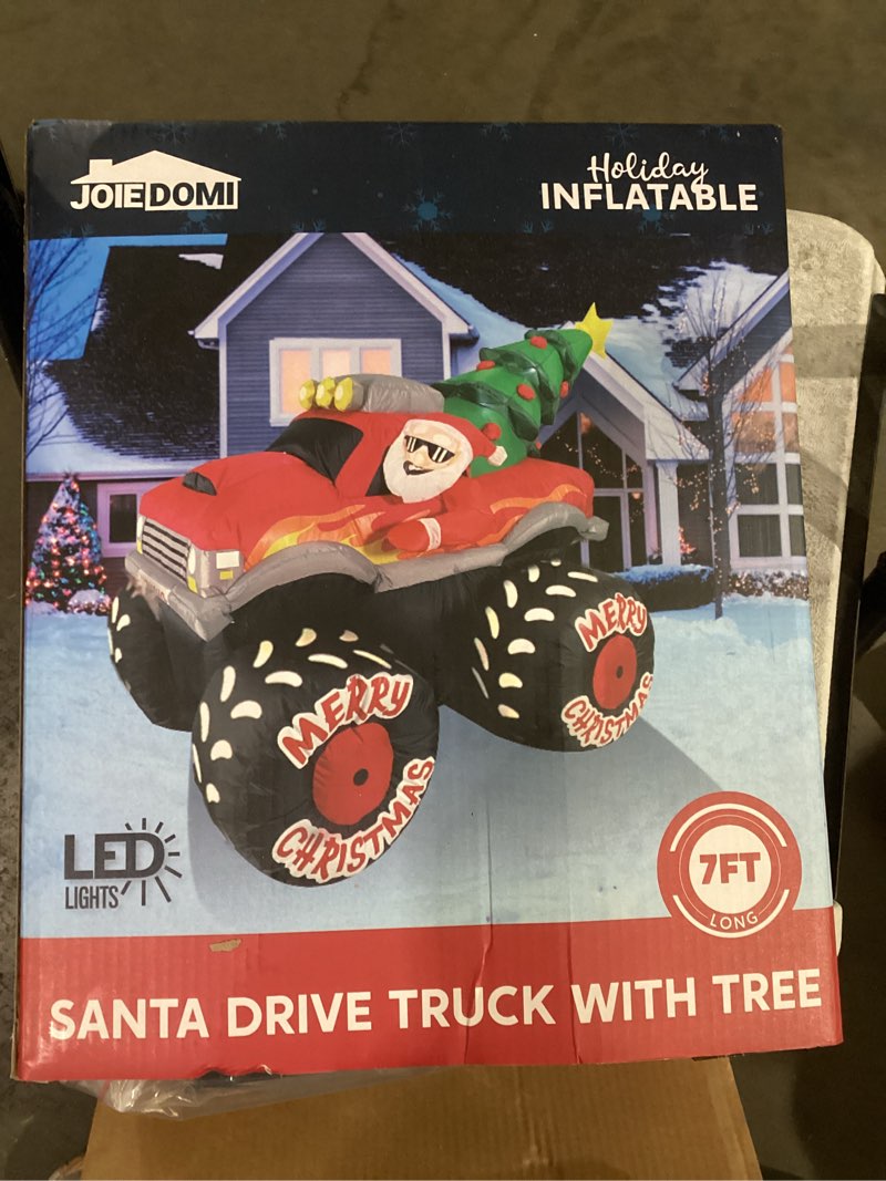 Condition photo showing New/Like New for JOIEDOMI 7 FT Long Christmas Inflatable Santa Driving Truck with Christmas Tree, Blow Up Santa on Truck with Build-in LEDs for Xmas Party Decor Yard Outside Garden Holiday Decoration