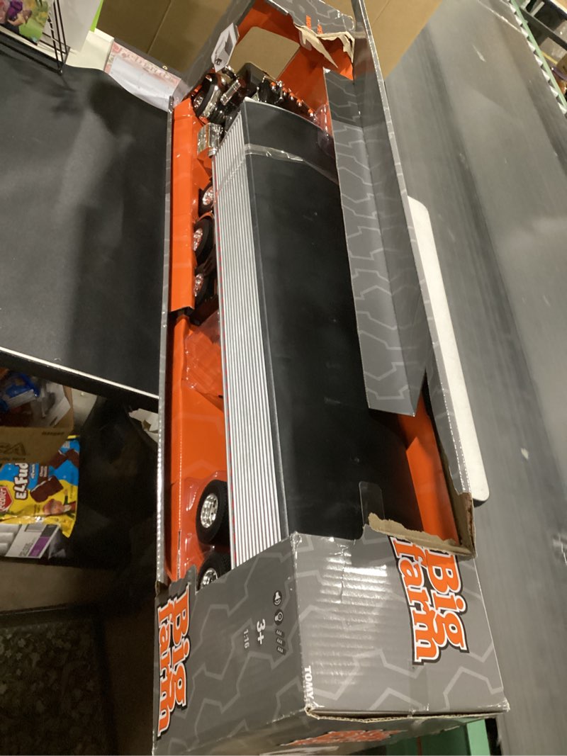 Condition photo showing item condition for ERTL 1/16 Big Roads Black Peterbilt Model 367 with Grain Trailer and Lights & Sounds 47367