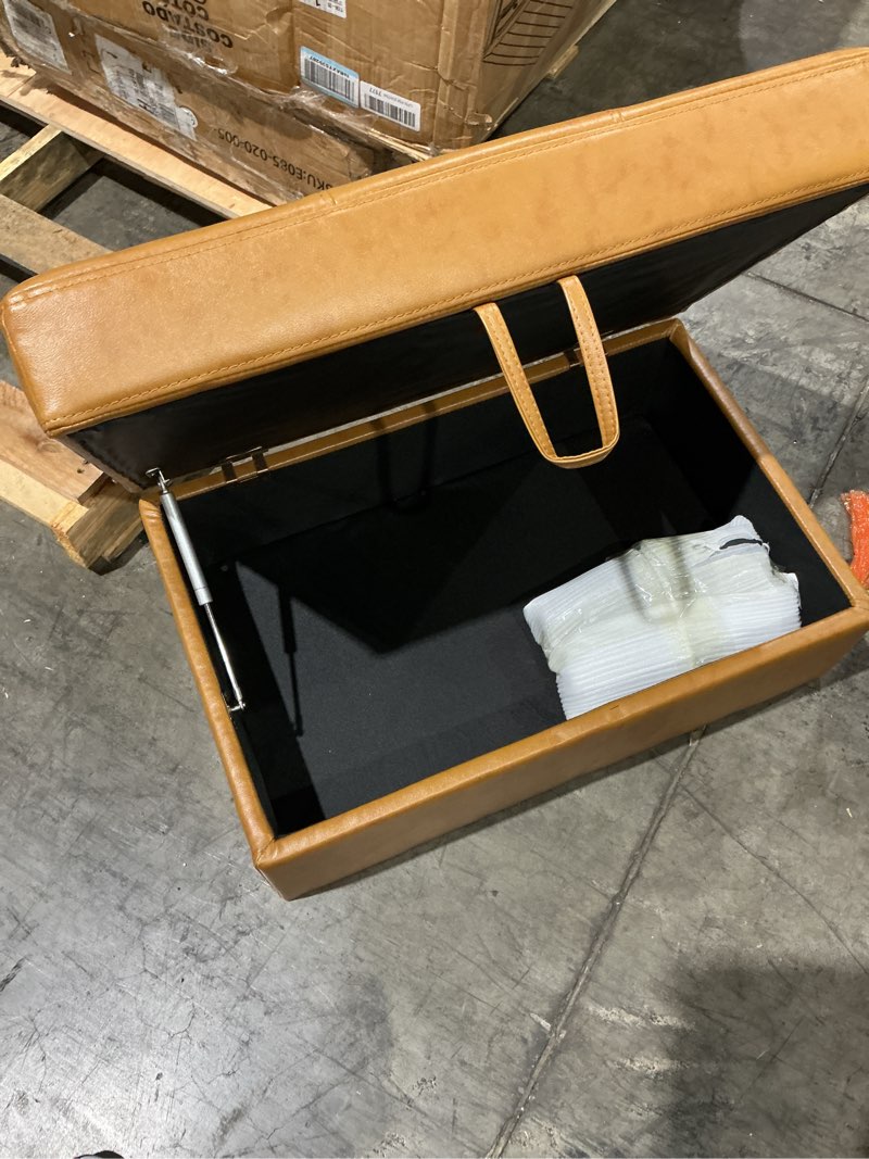 Condition photo showing Good Condition for this aswad camel faux leather storage ottoman bench features a top-opening lid with a convenient strap