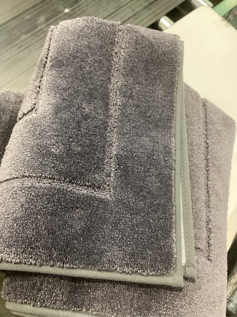 Condition photo showing As Is for Similar COTTON CRAFT Bath Mats - 2 Pack 100% Cotton 21x30 Inches - Ultra Absorbent - Plush 900 GSM - Banded Border Luxury Towel Rug - Step Out Tub Shower Floor Mat -Not a Bathroom Rug - Charcoal Grey 2 Pack Charcoal