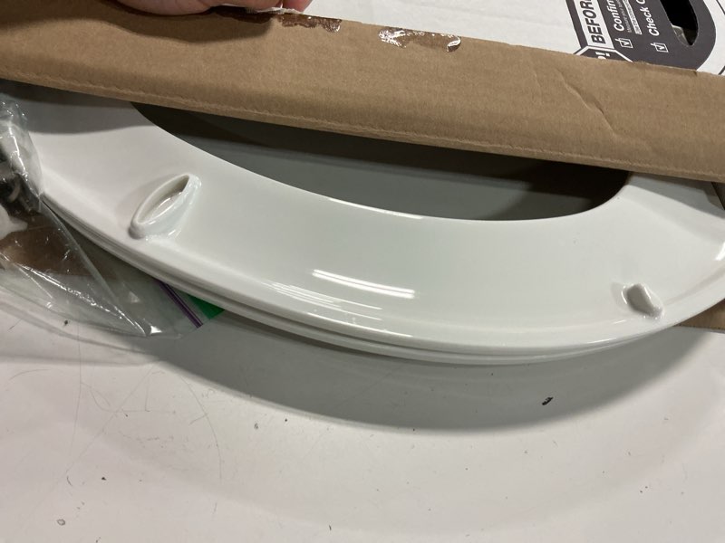Condition photo showing As Is for kohler 20110-0 brevia, slow close toilet seat, elongated toilet seat, grip-tight bumpers quick-attach hardware, white white elongated quiet-close