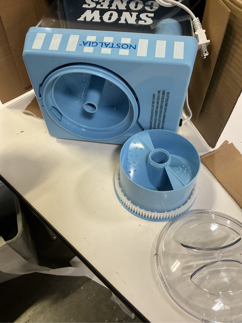 Condition photo showing As Is for Nostalgia Snow Cone Shaved Ice Machine - Retro Table-Top Slushie Machine Makes 20 ICY Treats - Includes 2 Reusable Plastic Cups & Ice Scoop - Vintage Blue