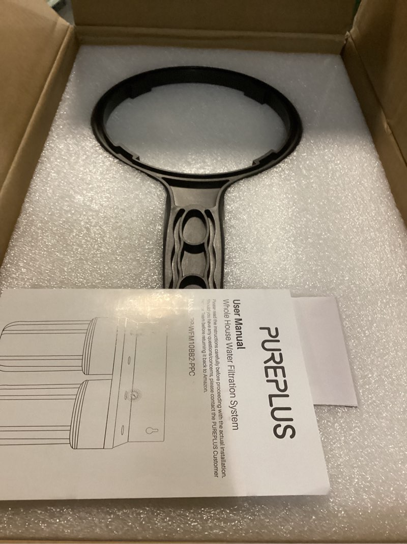 Condition photo showing New/Like New for pureplus 2-stage whole house water filtration system, 10" x 4.5" universal housing, nsf/ansi 42 certified sediment & carbon block filters, 1" inlet/outlet, includes external pressure gauges