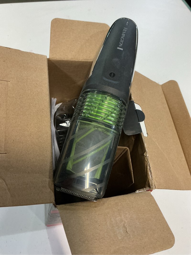Condition photo showing As Is for remington vacuum beard trimmer,13 length and style settings with adjustable length comb (2-18mm),vacuum trimmer for beard, mustache, and stubble, rechargeable lithium power, washable, removable blades 2 piece set black/green