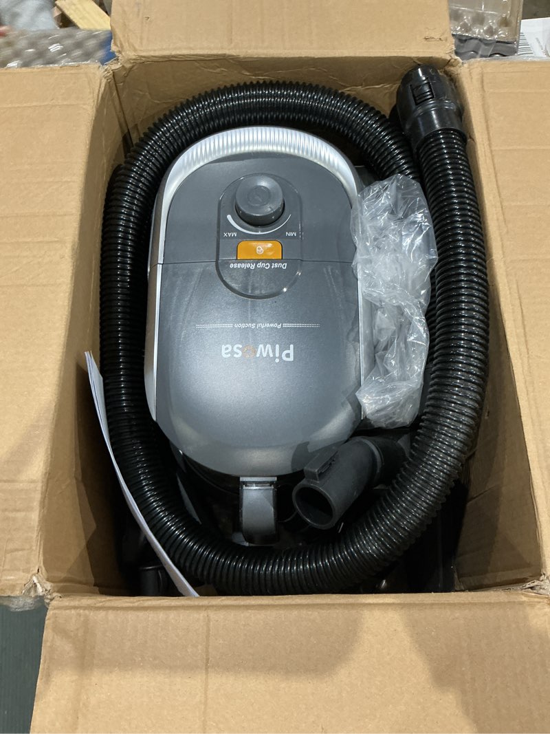 Condition photo showing As Is for aircliff canister vacuum cleaner, specially designed nozzle for pet family, 1200w & 17kpa strong suction, 2 hepa filters & 5 cleaning tools for hard floor, carpet, upholstery, pet hair(sliver)