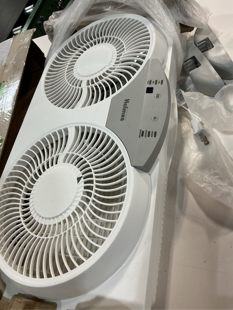 Condition photo showing As Is for holmes 9" twin digital window fan, reversible airflow blades, in/out exchange, 3 speeds, built-in extender panels, ideal for home, bedroom or office, remote control, white digital control w/ remote 9 inch