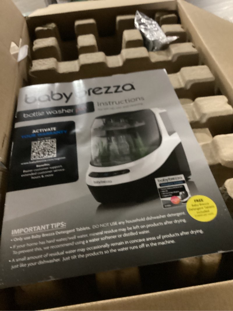 Condition photo showing New/Like New for baby brezza bottle washer pro - baby bottle washer, sterilizer + dryer - all in one machine cleans baby essentials, bottles + pump parts – appliance replaces bottle brushes & drying racks, charcoal