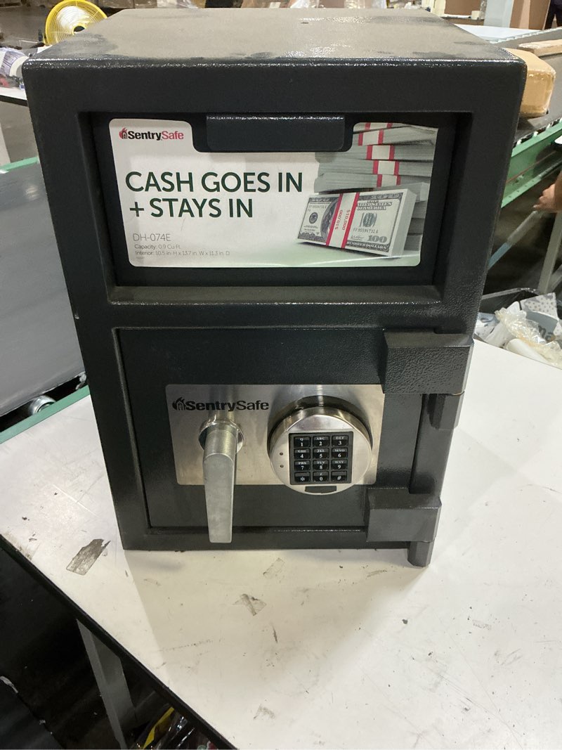 Condition photo showing As Is for sentry safe dh-074e front loading depository safe by sentrysafe (code unknown) (dial pad screws off to the left to change batteries)