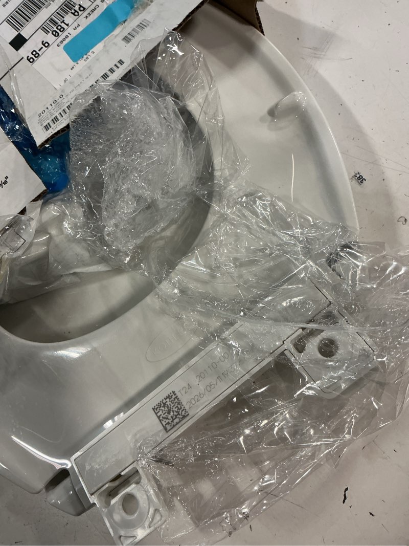 Condition photo showing As Is for kohler 20110-0 brevia, slow close toilet seat, elongated toilet seat, grip-tight bumpers quick-attach hardware, white white elongated quiet-close