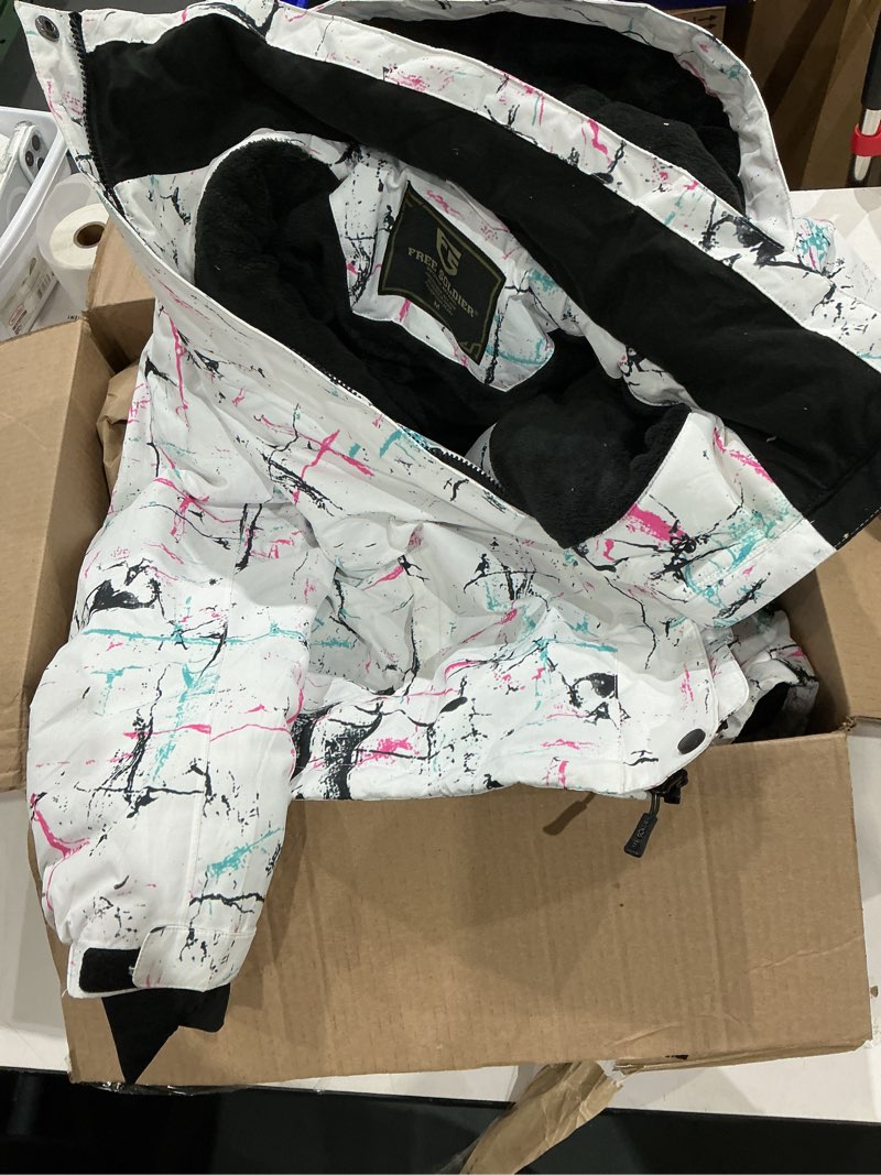 Condition photo showing As Is for this item is a free soldier women's waterproof windproof ski jacket featuring a white base with a pink and blue abstract print. 