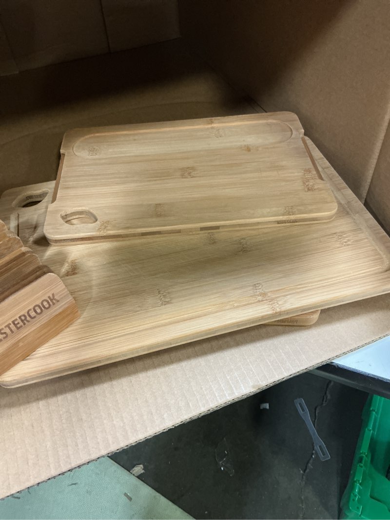 Condition photo showing Good Condition for astercook deep-carbonized bamboo cutting boards for kitchen with wood storage stand, reversible charcuterie & chopping boards with juice grooves and easy-grip handles, knife-friendly, kitchen gift
